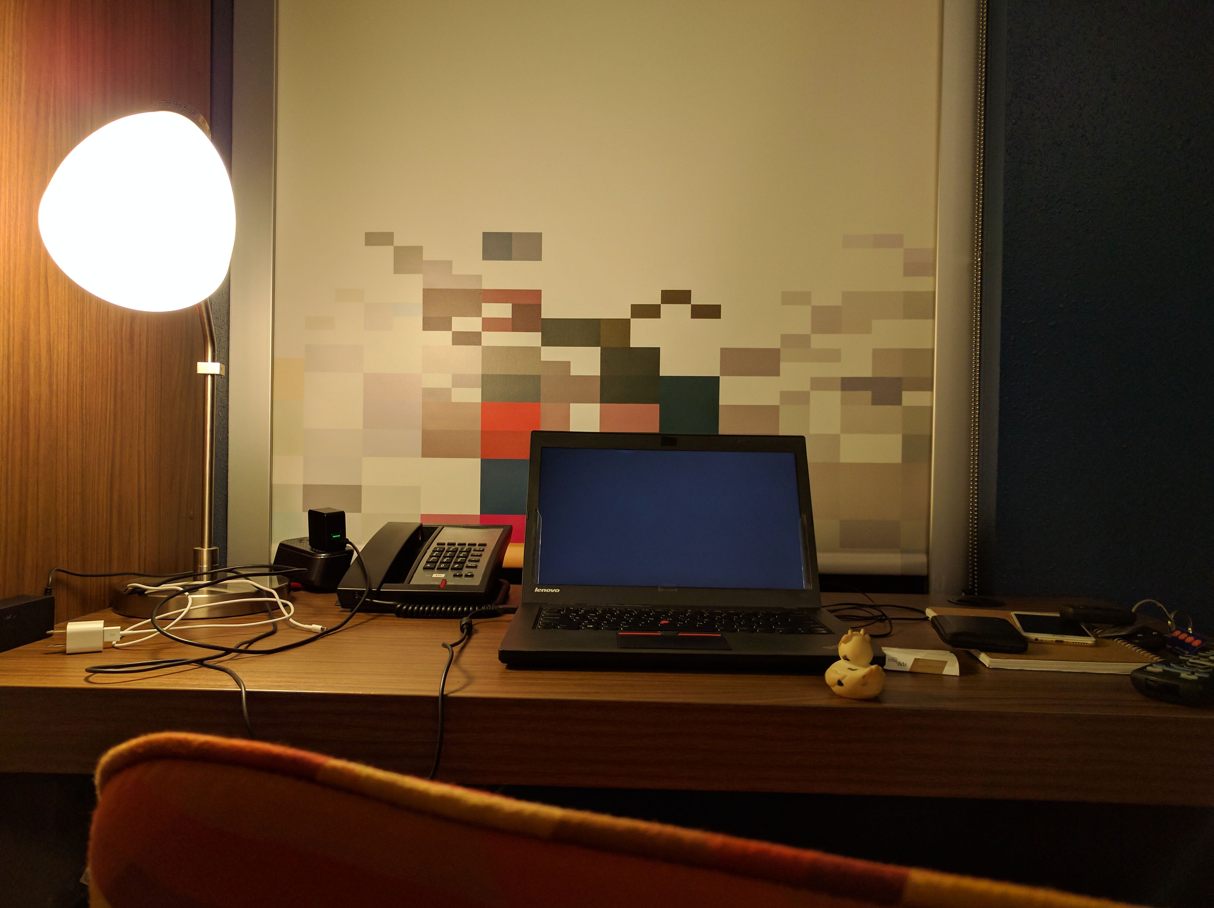 A photo of Bella the duck at a hotel room desk in Raleigh, North Carolina